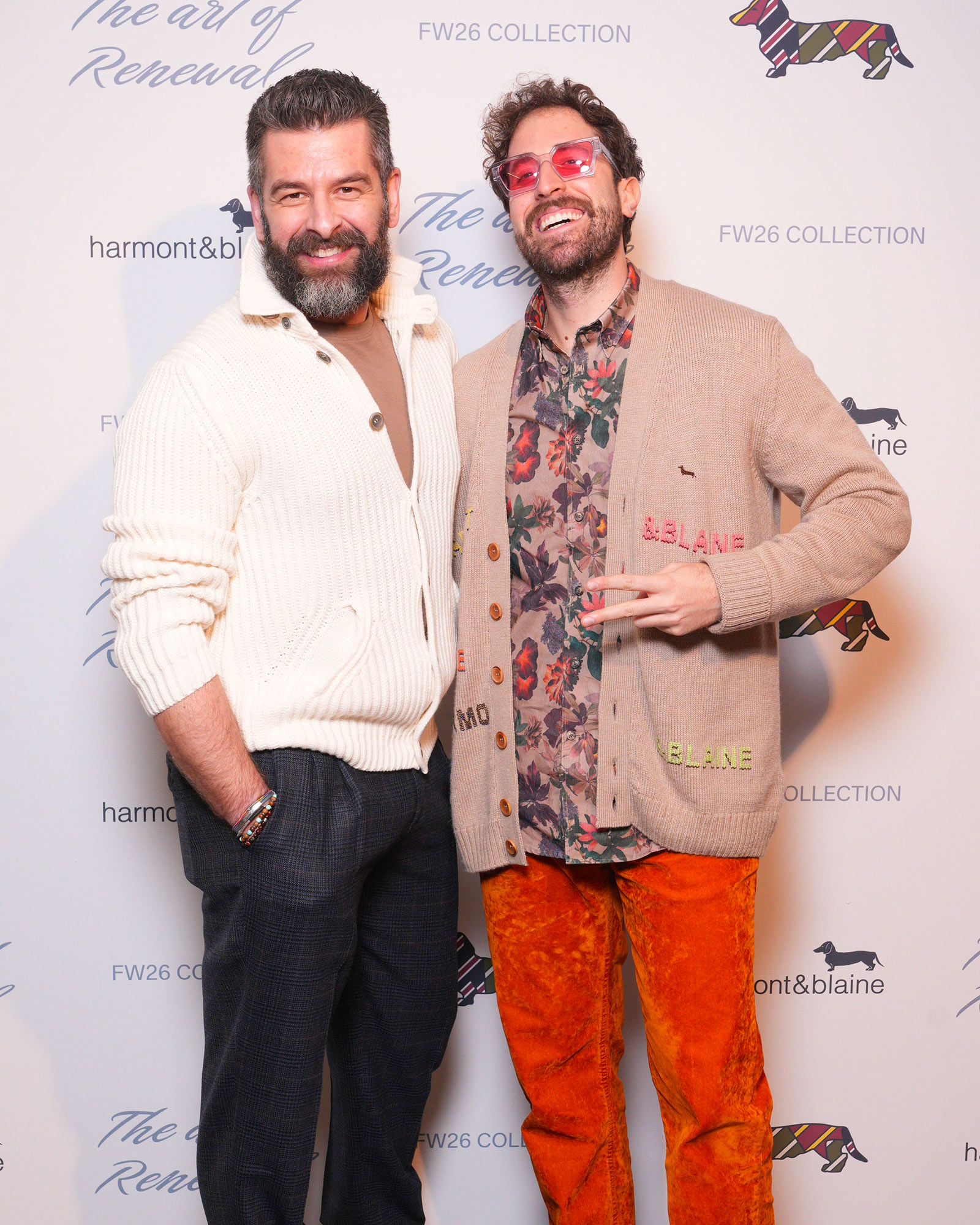 Two men in casual looks with cardigan and printed shirt