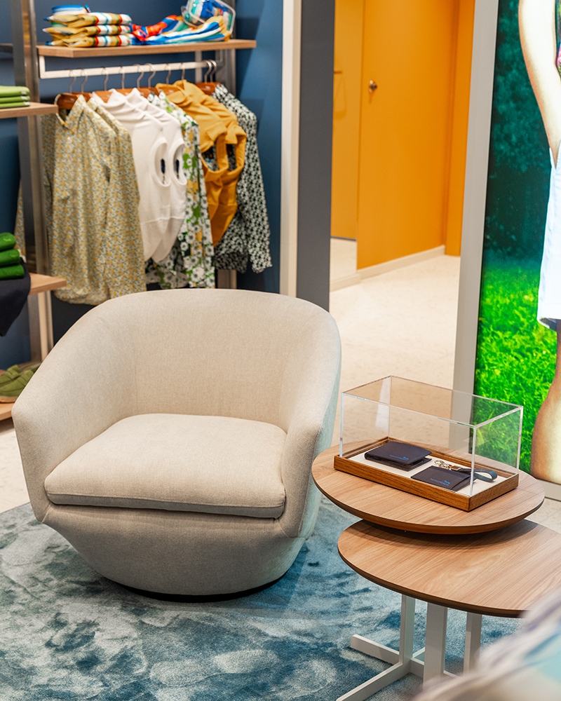 Detail of the lounge area with armchair and accessories.