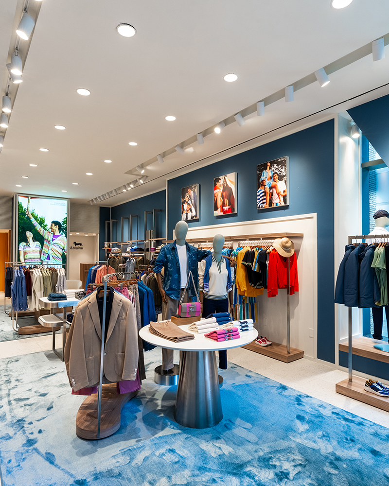 Inside view of the Harmont & Blaine store with colorful clothing.